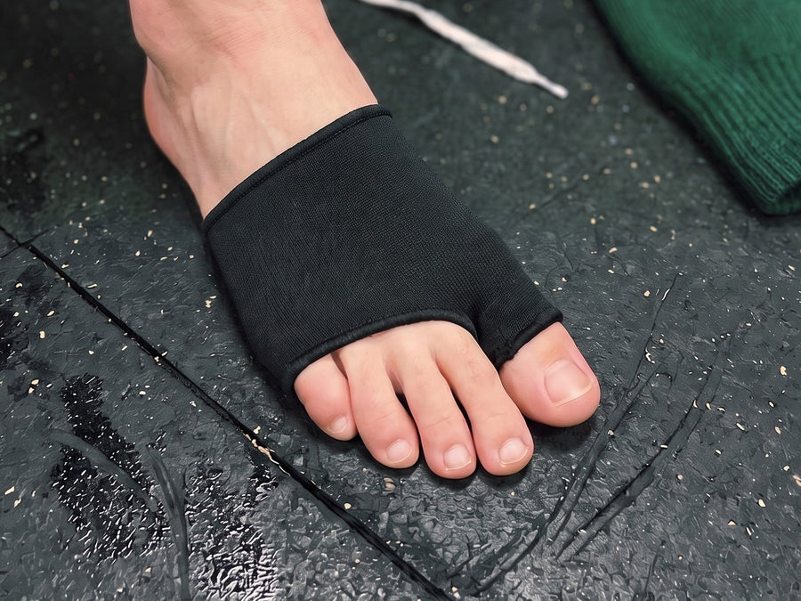 Step 1: sliding the sleeve onto a bare foot