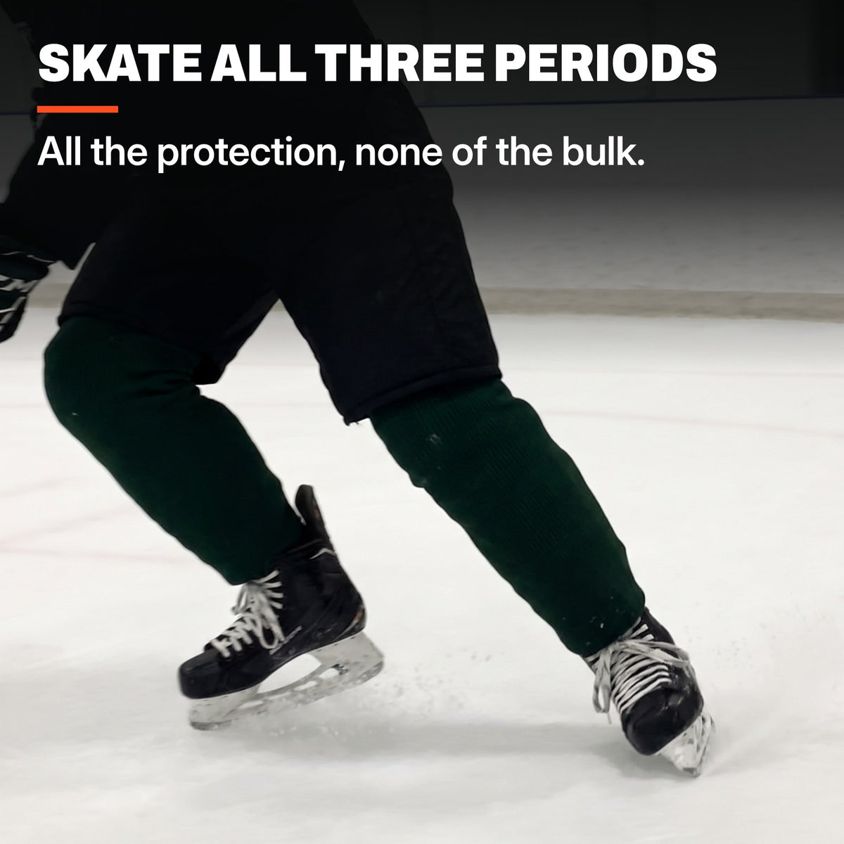 Hockey player pushing off on the ice, low angle on the skates